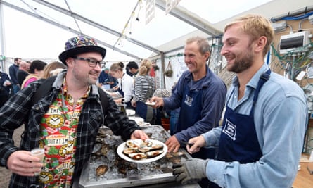Tristan Hugh-Jones, centre, serving up oysters.