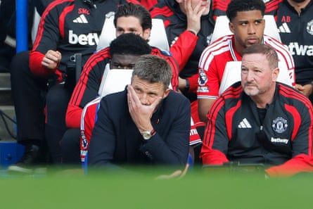 Michael Carrick looks pensive on the bench