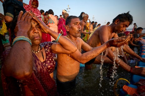 Pilgrims bathe in Prayagraj as the festival rites continue.