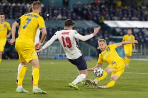 Mason Mount of England clears the ball from the boot of Oleksandr Zinchenko.