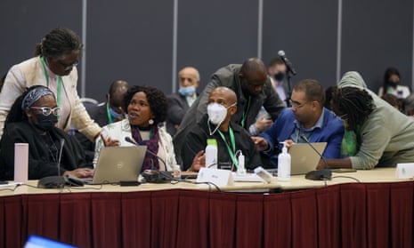 Delegates confer during pre-negotiations on targets of the draft global biodiversity framework