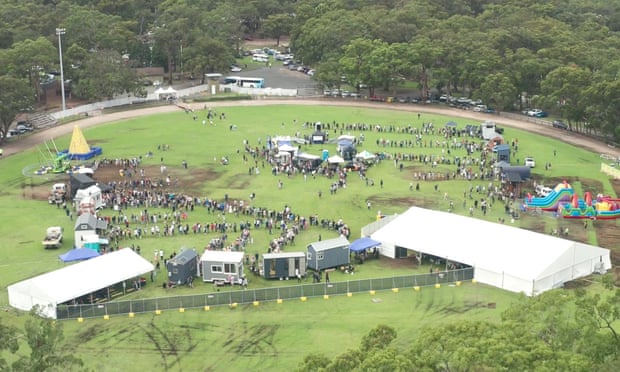 Aerial photograph of people queueing to enter tiny homes at the Tiny Homes Carnival
