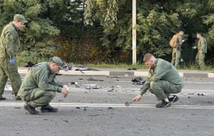 Investigators work on the site of explosion of a car driven by Daria Dugina, the daughter of Alexander Dugin, the Russian nationalist ideologist often called ‘Putin’s brain’, who was killed when her car exploded on the outskirts of Moscow
