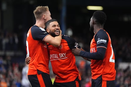 Nahki Wells (centre) celebrates pinch Shandon Baptiste (right) and Cauley Woodrow afer his hopeful agelong shot was headed location by Wimbledon’s Ryan Johnson.