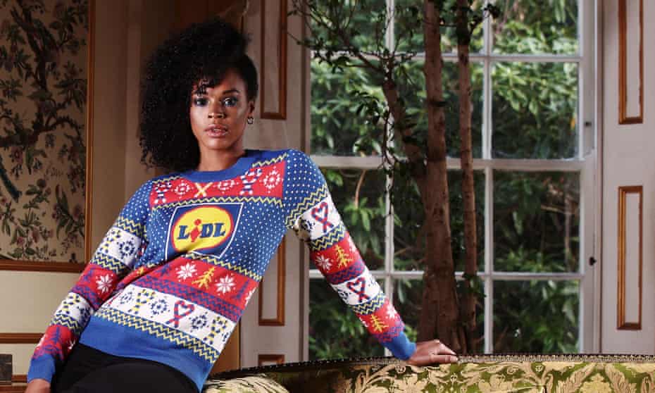 a model wears a Lidl-logoed festive jumper