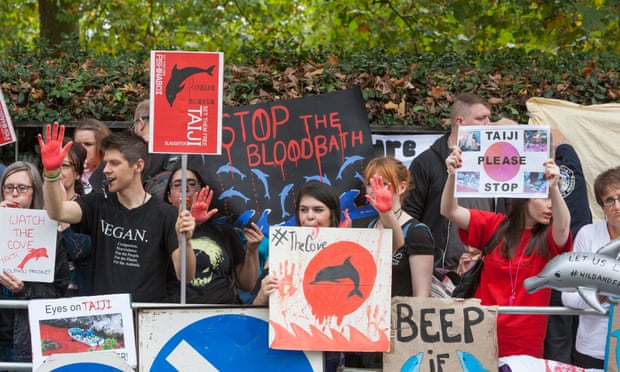 Activists stage ‘bloody’ protest outside Japanese Embassy in London against the annual dolphin slaughter at Taiji Cove.