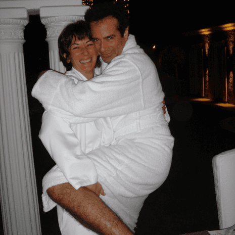 a woman and a man embracing in white robes