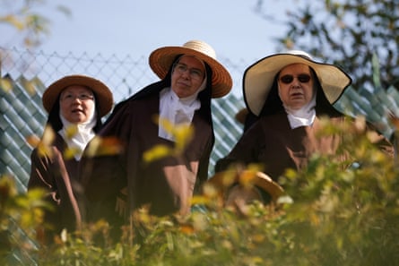 Carmelite nuns attend mass celebrated by Pope Leo XIV in Lourdes, France.