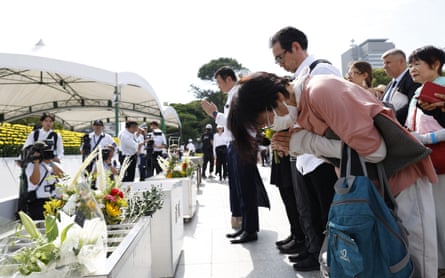 People pray in front of the cenotaph at the Peace Memorial Park in Hiroshima on Wednesday.