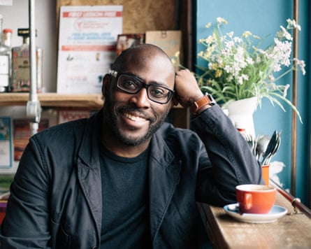 Mike in a cafe with a cup of coffee