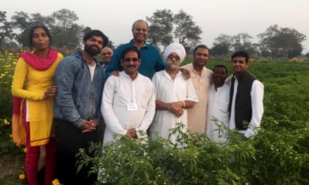Dr. Prabhakar Rao (in a blue brief) at his farm in Bangalore.
