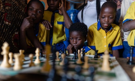 Young Nigerians are entranced by a game organised through the non-profit organisation  Chess in Slums Africa.