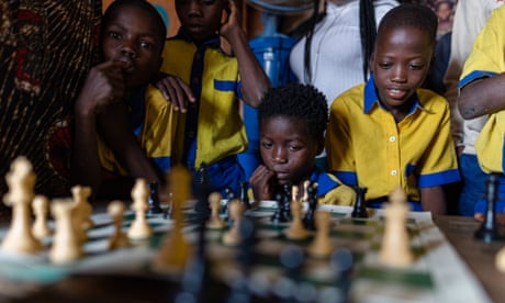 Young Nigerians are entranced by a game organised through the non-profit organisation Chess in Slums Africa.