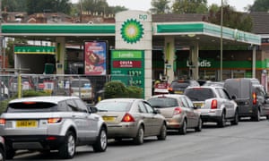 Vehicles queue outside a BP petrol station in Alton, Hampshire.