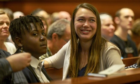 Plaintiff Vic Barrett, left, and Kelsey Juliana gathering with other youth plaintiffs in the Juliana v. United States climate change lawsuit in a federal courthouse for a hearing in front of a panel of judges in June.
