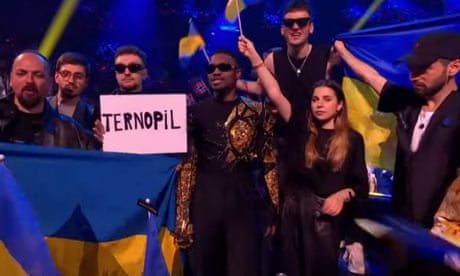 Tvorchi hold a sign with the name of Ternopil, their Ukrainian home town, at the Eurovision finale.