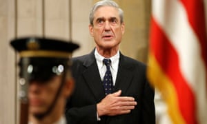 Robert Mueller stands for the national anthem during a ceremony at the justice department in Washington in 2013.