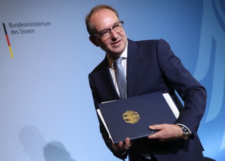 Man in suit with blue folder