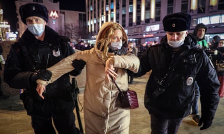 Russian police detain a protester during an anti-war rally in Moscow on Thursday.