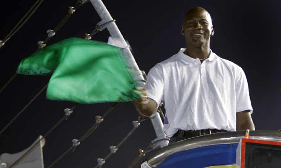 Michael Jordan waves the green flag before a Nascar race at Charlotte Motor Speedway in 2010