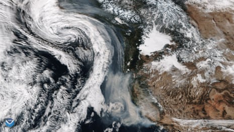 California wildfire smoke wrapped up into an approaching storm.