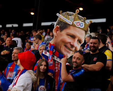 Crystal Palace fans hold up a cutout of manager Oliver Glasner