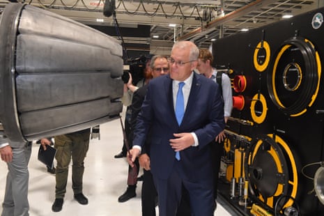 Prime minister Scott Morrison looks at a F-18 Super Hornet engine at TAE Aerospace near Ipswich, west of Brisbane, in the seat of Blair.
