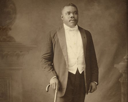 Portrait photograph of Marcus Garvey formally dressed with cane, 1920. \