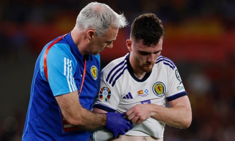 Andy Robertson is helped from the pitch after sustaining the injury during a Euro 2024 qualifier in Sevilla last Thursday