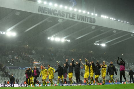 Borussia Dortmund players celebrate after their victory over Newcastle United.