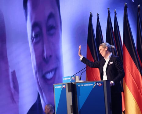 Elon Musk on videolink with Alice Weidel on a stage in front