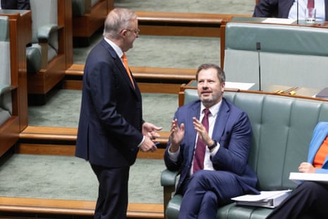 The Prime Minister Anthony Albanese talks to the Minister for Industry and Science Ed Husic during question time
