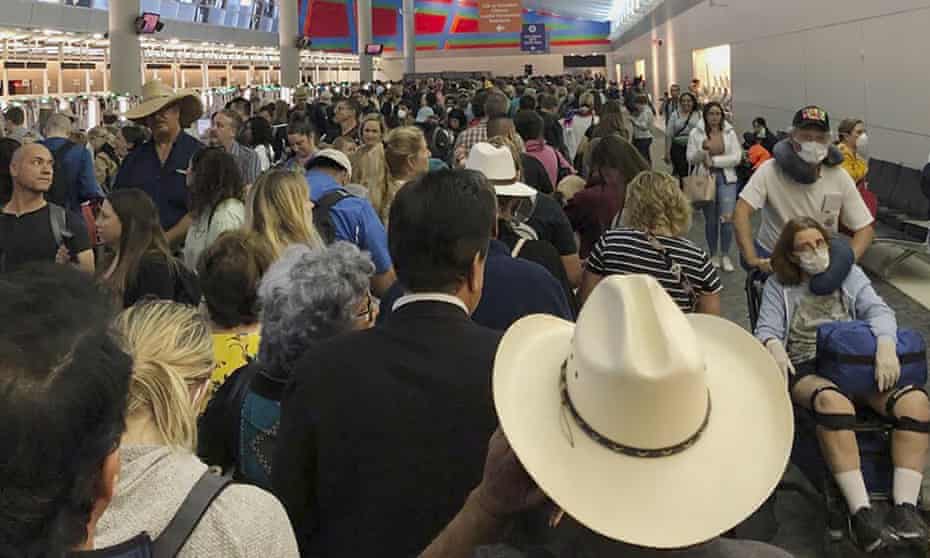 People wait in line to go through the customs at Dallas Fort Worth International Airport in Grapevine, Texas.
