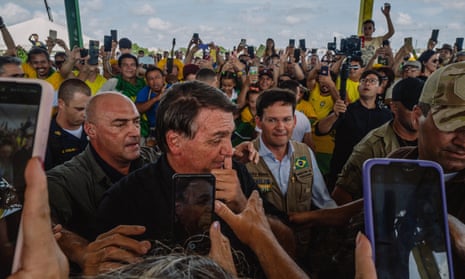 President Jair Bolsonaro is welcomed by supporters during the inauguration of a new train station in Parnamirim, Rio Grande do Norte.