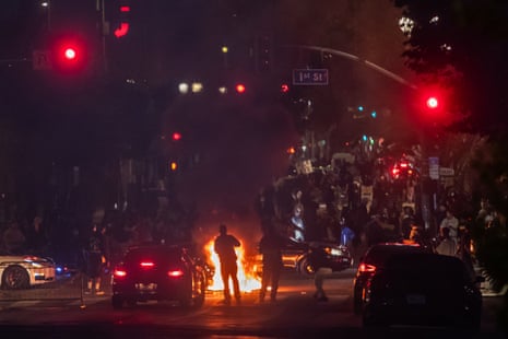 Protesters set trash cans on fire in front of City Hall during clashes with the police on 8 June, 2025 in Los Angeles, California.