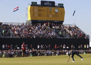 United States’ Collin Morikawa places his ball on the 18th green.