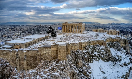 The ancient Acropolis hill in Athens covered with snow.