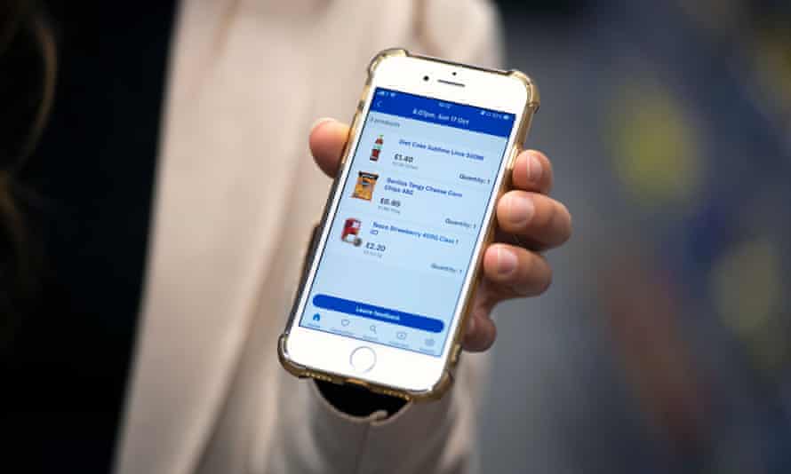 A mobile phone, held in a hand, showing an itemised supermarket receipt