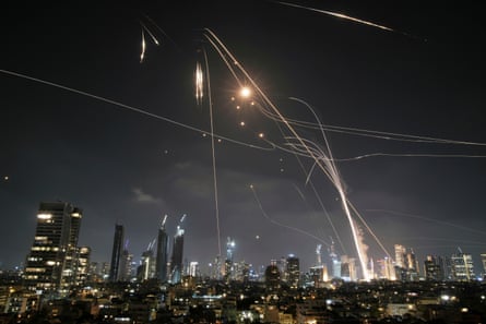 Israel’s Iron Dome air defence system fires to intercept missiles over Tel Aviv, Israel.