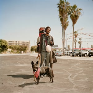 Denzell, 20, drifter by choice, with his dog Magic in Los Angeles.