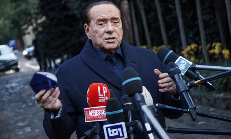 Berlusconi speaks to the media after a December meeting with center-right leaders in Rome.