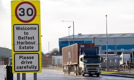 A lorry drives past a sign welcoming drivers to Belfast Harbour Estate in Belfast, Northern Ireland