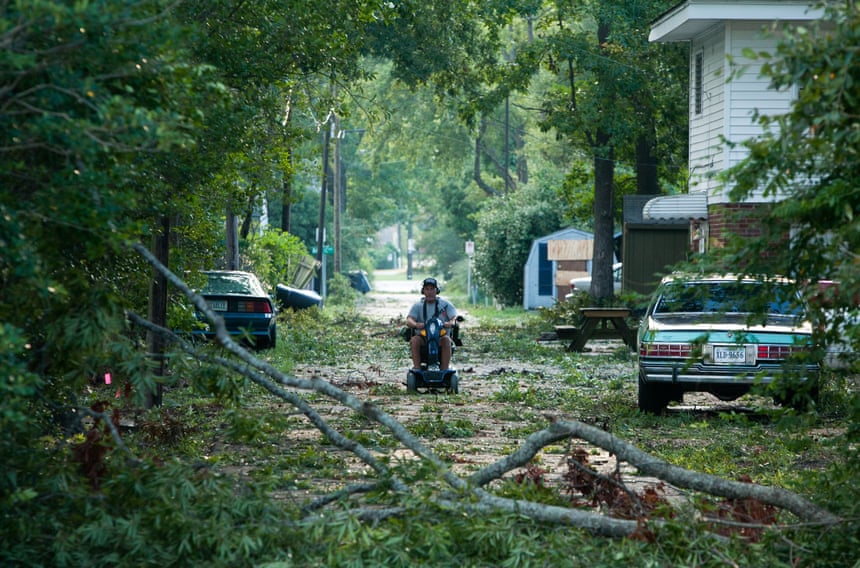 Branches litter an alley as a result of a hurricane in Virginia Beach, VA.