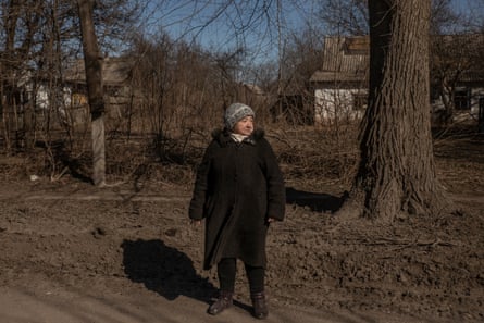 Liubov Hryhorivna standing at a roadside