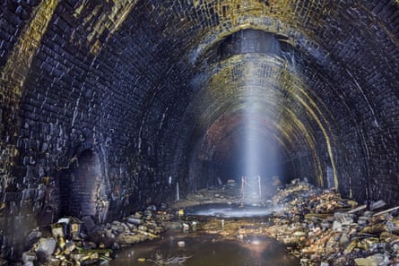Water descending through a shaft into the tunnel.