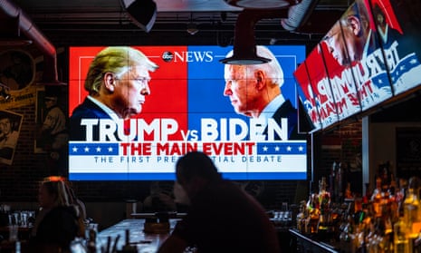 Big tv screen in a bar with Trump v Biden debate ad
