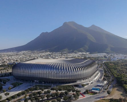 An aerial view of Estadio BBVA with the Cerro de la Silla in the background.