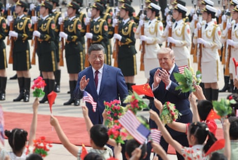 Xi Jinping and Donald Trump attend a welcome ceremony at the Great Hall of the People, in Beijing.