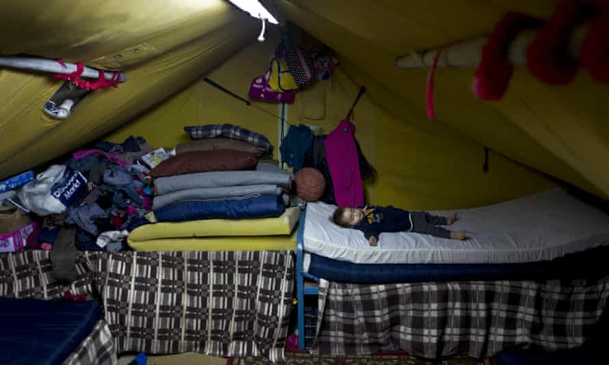 Syrian refugee Elan Darwish, 14 months, sleeps inside his family’s tent in Kalochori refugee camp on the outskirts of Thessaloniki
