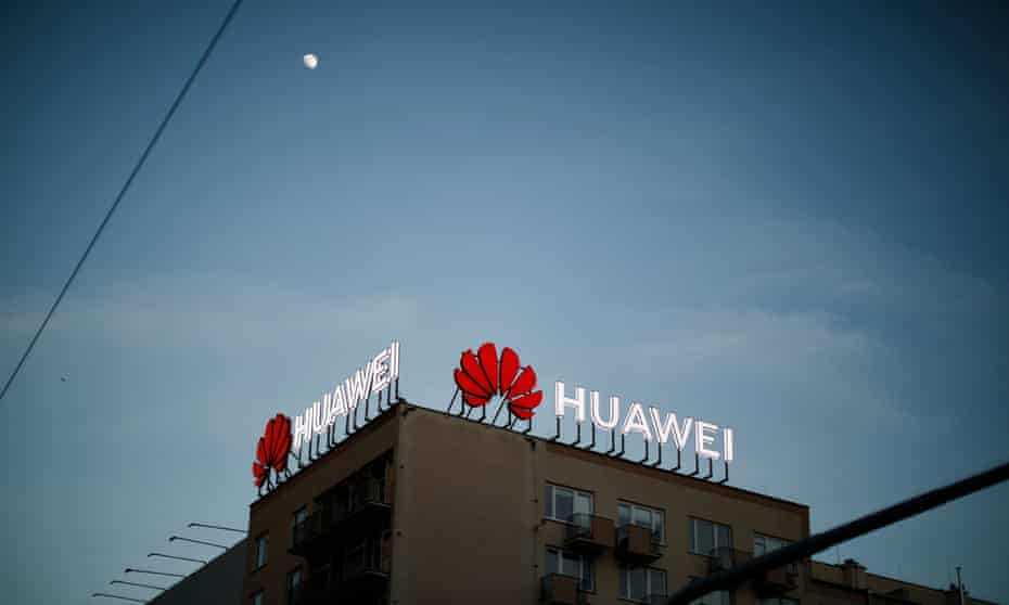 Huawei neon advertising signs on a rooftop in Warsaw, Poland.